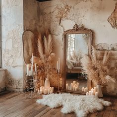 a room with a mirror and candles on the floor next to a sheepskin rug