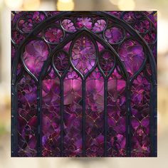 a stained glass window with purple flowers on it