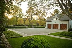 a house with a tennis court in the front yard