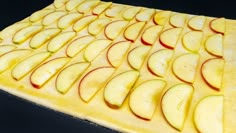 sliced apples on a cutting board ready to be cut into wedges and put in the oven