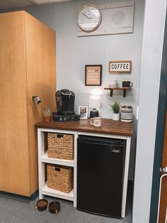 a kitchen with a black refrigerator freezer sitting inside of it