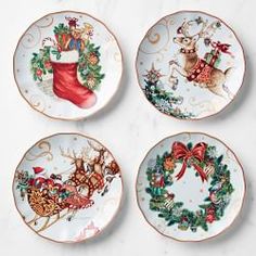 four plates with christmas decorations on them