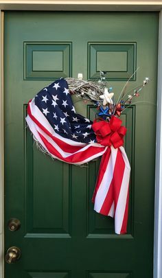 an american flag wreath on a green door