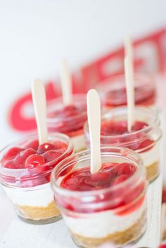 mini desserts with cherries in small glass jars