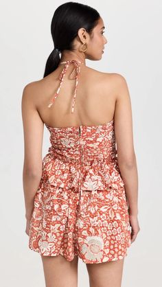 An elevated Ulla Johnson romper, featuring the label's signature halter neckline and an intricate print. Ruffly trim adds subtle emphasis to the waist. Heeled and flat sandals will both be nice accompaniments for this piece. Fabric: Lightweight non-stretch poplin Allover pleating and ruffle edges Halter neck and cutouts at front Covered elastic waist with interior drawstring Hidden zip at back Slant hip pockets Shell: 100% cotton Partially lined Lining: 92% cotton/8% spandex Wash cold Elegant Rompers, Cardigan Sweater Jacket, Gothic Dress, Crop Top Blouse, Boho Maxi Dress, Be Nice, Halter Neckline, Cutout Dress, Cardigan Tops