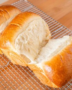 two loaves of bread on a cooling rack