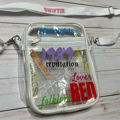 a clear bag with words on it and a lanyard around the strap that is attached