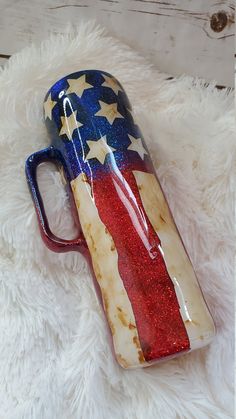 American Flag Patriot Glitter Tumbler is a tribute to my mother. She loves history so much and she is a huge patriot. She loves this country and loves what the Flag stands for! This flag patriot tumbler looks as though it has been around for a very long time. Just like the real American Flag! Stainless Steel double walled, vacuum insulated. This means that hot things stay hot and cold things stay cold for many hours. This tumbler can be made with glitter or without glitter for those non glitter loving people. This tumbler will come with the phrase We the People on it. If you choose the skinny with handle, the phrase will be placed on the handle. If you choose a different cup base then you need to tell me where you want the saying. If you don't specify where you want the saying I will choos Patriotic Tumbler, Flag Stand, To My Mother, Mason Jar Mug, Love People, American Flag, Mason Jars, Tumbler, Flag