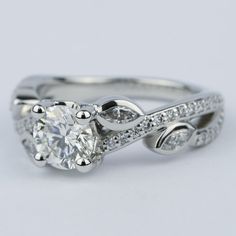 a white gold engagement ring with an oval cut diamond