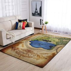 a living room with a couch and rug on the floor