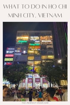 people walking around in front of a tall building at night with text overlay that reads what to do in ho chien, minh city, vietnam