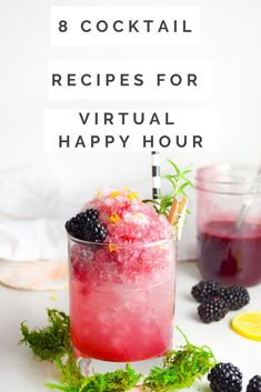 a cocktail with berries and lemons in it next to some blackberries on the table