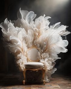 a chair with feathers on it sitting in front of a wall