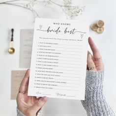 a person holding up a card that says who knows the bride best