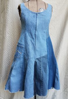 "Are you an eco-savvy gal who treasures upcycled, restyled apparel? If so, you will adore this blue patchwork denim dress, made from recycled jeans, pieced together!  It has a pocket on the front right hip, for your cell phone or other modern necessities. The front zipper & slightly frayed hem lend  a bit of edge, while the sleek silhouette gives it polish. This dress could be perfect with a jacket for casual Fridays, or without, for a night on the town.  It's figure flattering, with a narrow waist and flared skirt, to accentuate your curves.  Measurements: bust 38\", waist 34\", hip 40\".  It's machine washable, just like your favorite blue jeans!" Jean Patchwork, Upcycled Dress, Denim Inspiration, Casual Fridays, Recycled Jeans, Patches Fashion, Patchwork Denim, Upcycle Jeans, Patchwork Jeans