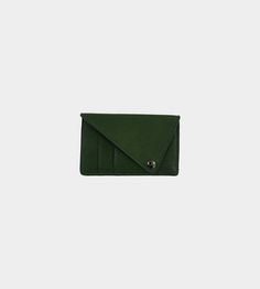 Triangle leather card holder from discord yohji yamamoto featuring gunmetal-tone hardware triangle shape fold over top with press-stud fastening card slots rear zip-fastening pocket in green calf leather.    vendor colour: green    vendor style: dj-a15-715    composition: 100% leather (cowhide)    made in japan.    dimensions:  7.5cm x 12cm x 1cmm Green Leather Card Holder With Rfid Blocking, Green Leather Rfid Blocking Card Holder, Modern Green Wallets With Rfid Blocking, Modern Green Leather Wallets, Modern Green Leather Wallet, Modern Green Bifold Card Holder, Green Leather Trifold Wallet With Card Slots, Leather Card Holder, Yohji Yamamoto