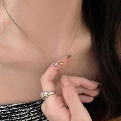 Metals Type : zinc Alloy Fine or Fashion : fashion Product Description:1.Product name: Heart Minimalist Necklace2.Product size: Necklace length:50cm(19.69in),Pendant size:8*8mm(0.31*0.31in)3.Product style: as shown in the picture4.Product color: Golden,Silvery5.Product material: AlloyFeatures:1.Unique and stylish: This heart pendant necklace for women is a trendy and distinctive accessory that embodies the cool and minimalist aesthetic of the fashion.2.Minimalist design: The simple and understat Heart-shaped Alloy Necklaces For Mother's Day, Mother's Day Heart Pendant Alloy Necklace, Heart-shaped Alloy Necklace, Rose Gold Heart Beads Necklace, Trendy Alloy Jewelry With Heart Charm, Heart Charm Pendant Necklace In Alloy, Alloy Pendant Necklace With Heart Charm, Heart Shaped Alloy Necklace With Adjustable Chain, Heart-shaped Alloy Necklace For Mother's Day