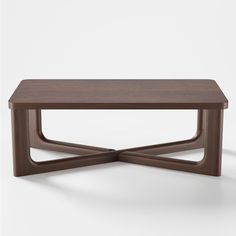 a wooden table with an unusual design on it's top and bottom, against a white background