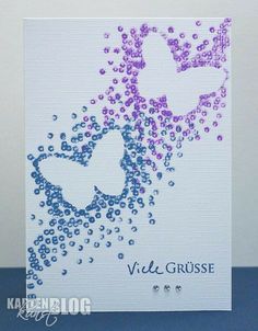 a white card with purple and blue hearts on it