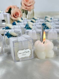 small candles are sitting next to each other on a table