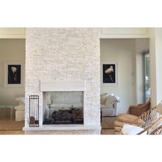 a living room filled with furniture and a fire place