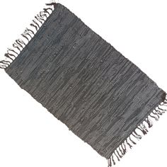 a black and white rug with fringes on it