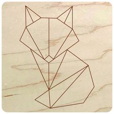 an animal made out of geometric lines on a marble surface with the word fox written in it