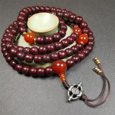 ❤This mala is made by Tibetan craftsmen and come from Hepo Town, Baiyu County,Tibet, the birthplace of the famous Tibetan handicrafts.It's composed of 108 pcs 9mm lotus seed beads,with agate spacer beads,and agate bead counters,diameter 0.35",circumference 35".❤Details:Mala'perimeter is 88cm,35 inches.108 lutus seed beads approximately 9mm / 0.35 inch.1 × agate main bead,diameter 12mm × 10mm / 0.47 × 0.4 inch.2 × agate spacer beads diameter 10mm / 0.4 inch.1 × agate guru bead,22mm × 13mm / 0.87 Traditional Handmade Beaded Bracelets For Meditation, Traditional Beaded Bracelets For Meditation With 108 Beads, Handmade Spiritual Mala With Oval Beads, Spiritual Round Mala For Meditation, Spiritual Mala For Meditation, Handmade Mala For Festivals, Handmade Round Mala For Festivals, Traditional Mala With 108 Beads As Gift, Artisan Mala With Round Beads For Meditation