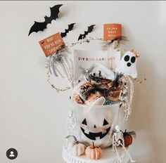 a white bucket filled with lots of halloween items