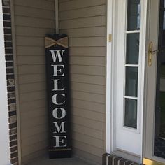 a welcome sign on the front porch of a house