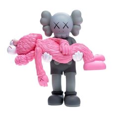 an elephant figurine holding a pink heart shaped object in its trunk on a white background