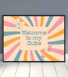 a poster with the words welcome to my cube on it in front of a gray wall