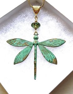 Large Gold vintage patina dragonfly pendant necklace, perfect dragonfly gift!  This dragonfly pendant is really stunning! Will definitely stand out in a crowd. Excellent gift for any dragonfly lover in your life, including yourself! The dragonfly totem carries the wisdom of transformation and adaptability in life. As spirit animal, the dragonfly is connected to the symbolism of change and light. When the dragonfly shows up in your life, it may remind you to bring a bit more lightness and joy int Adjustable Dragonfly Jewelry With Lobster Clasp, Handmade Bohemian Dragonfly Necklace, Bohemian Handmade Dragonfly Necklace, Elegant Green Dragonfly Shaped Jewelry, Elegant Patina Necklaces As Gift, Elegant Patina Necklaces For Gifts, Handmade Dragonfly Necklace For Gifting, Handmade Dragonfly Necklace For Gift, Vintage Handmade Dragonfly Jewelry