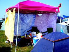 there are many tents set up in the grass