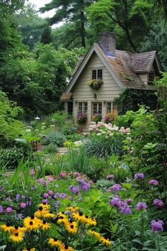 a house surrounded by flowers and trees