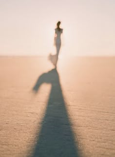 a person standing in the middle of a desert