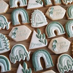 many decorated cookies are arranged on a table