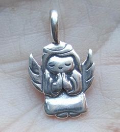 "measures:Size (mm): 12mm x 12mm x 1.5mm, or 1/2\". Price is for one charm at $6.00. You choose which one- Praying angel or angel with heart. Please write in notes to seller section when you purchase this item as to which charm you would like:Praying angel or angel with heart Please convo me if you would like more. I also have this angel charm available:Listing: https://www.etsy.com/listing/86396266/sterling-silver-angel-charmone" Personalized Small Charms For Gifts, Symbolic Sterling Silver Charms As Gift, Small Charm Necklaces For Gifts, Hypoallergenic Pendant Charm As A Gift, Cute Silver Charms For Gifts, Nickel Free Pendant Charms For Gifts, Nickel Free Spiritual Jewelry And Charms For Gifts, Hypoallergenic Pendant Charms For Gifts, Handmade Spiritual Charms As Gifts