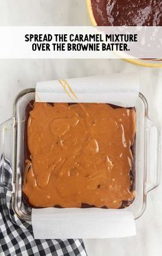 an overhead view of a cake in a pan with the text spread the caramel mixture over the brownie batter