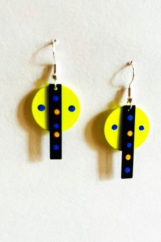 Funky, fun springtime earrings say you are happy today.  The disk is a bright yellow and the rectangular bar is black with colorful yellow and blue dots. These earrings are great with casual attire. They will make you smile.     Free Shipping and Gift Bag included Funky Handmade Yellow Earrings, Handmade Funky Yellow Earrings, Funky Yellow Handmade Earrings, Yellow Funky Handmade Earrings, Playful Adjustable Yellow Earrings, Yellow Funky Earrings For Gift, Modern Yellow Earrings For Everyday, Modern Yellow Earrings For Everyday Wear, Trendy Yellow Earrings For Everyday