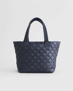 Transit Quilted Carry-All Tote Functional Quilted Bag For Daily Use, Versatile Quilted Bag For Outdoor, Navy Nylon Bag With Pockets, Navy Nylon Bags For On-the-go, Functional Navy Bag With Zipper Pocket, Functional Quilted Outdoor Bag, Functional Outdoor Quilted Bags, Navy Nylon Bags With Zipper Closure, Functional Navy Shoulder Bag With Zipper