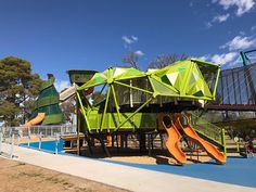 children's play area with slide and playground equipment