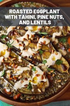 roasted eggplant with tahini, pine nuts, and lentils in a bowl