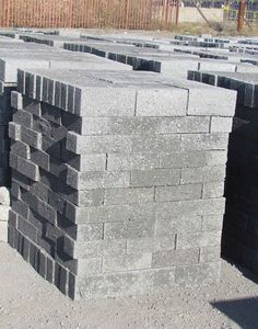 several blocks of concrete stacked together on the ground