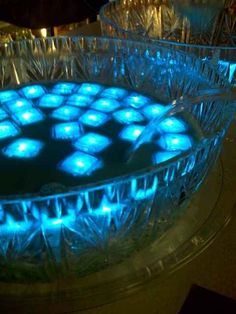 a glass bowl with blue lights in it