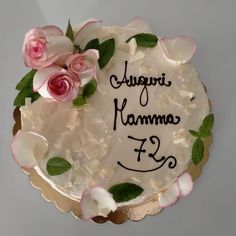 there is a cake with flowers on it and the words agugri hamma f3