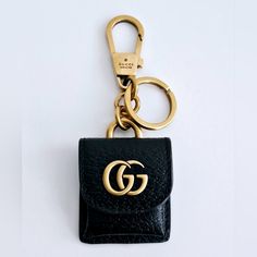 Authentic Preowned Gucci Gg Marmont Bag Charm/Key Chain In Black Leather Featuring Signature Double G Logo, Foldover Top With Press-Stud Fastening, Clasp Fastening, Keyring Attachment, And A Practical Hook That Attaches Easily To Your Keys And Handbags. In Excellent Condition. Made In Italy. Gucci Key Chain, Chic Gucci Wallet On Chain With Gold-tone Hardware, Gucci Key Rung, Gg Marmont Bag, Gucci Designer Wallet On Chain With Gold-tone Hardware, Double G Logo, Luxury Gucci Bag With Gold-tone Logo Plaque, G Logo, Gucci Gg Marmont