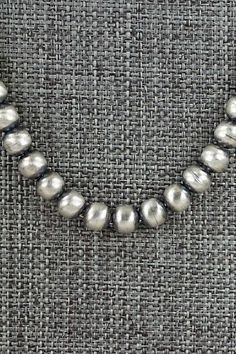 This sterling silver Navajo pearl necklace was made by Navajo silversmith Dorinda Mariano.Necklace: 20"Bead size: 3/16" x 3/16" (5mm x 5mm)Free shipping on all orders! We ship with USPS and always include tracking. All orders ship within a day of payment.Returns are accepted up to 30 days after you receive your order. Just send us a message. Our shop offers cash back or store credit. The item must be returned in new condition. Navajo Necklaces, Navajo Pearl Stacks, Navajo Pearls And Turquoise Necklace, Sterling Silver Navajo Pearls, Navajo Silver Jewelry, Native American Jewelry, Pearl Necklace, Sterling Silver, Beads