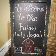 a chalkboard sign that says welcome to the farm baby joseph