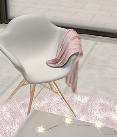 a white chair sitting on top of a pink rug